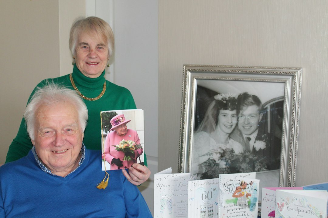 elderly woman showing photo album
