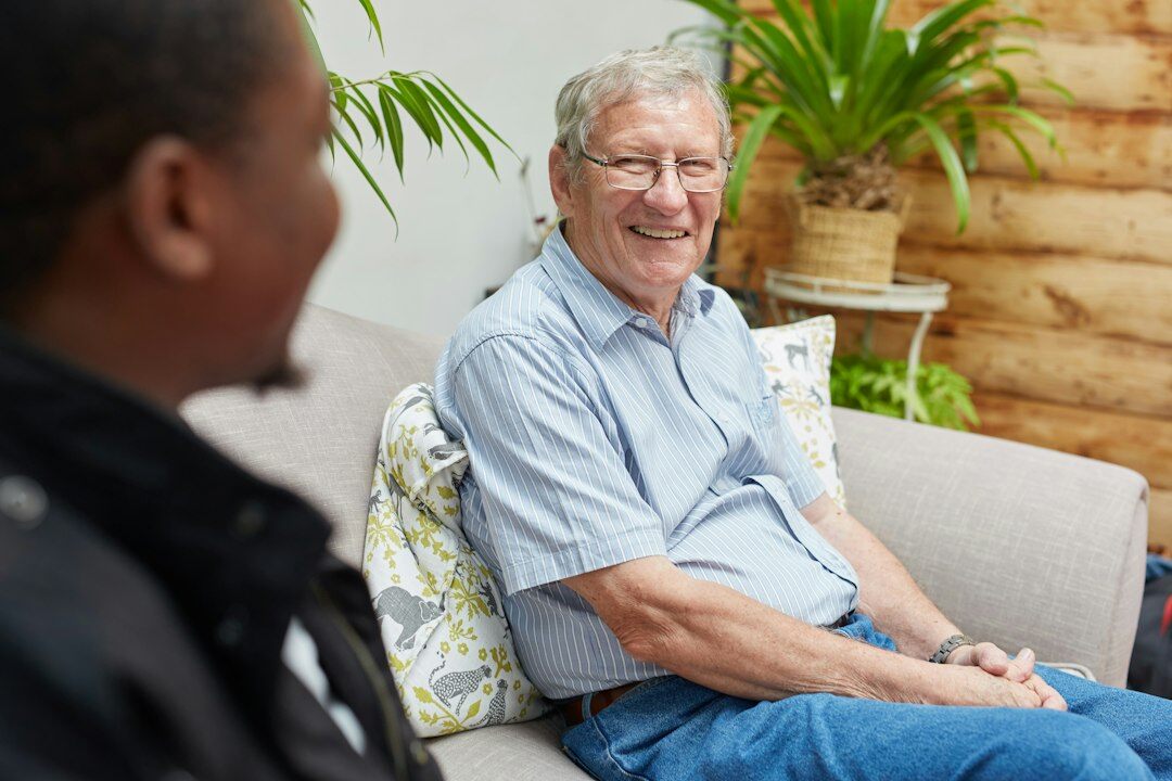 man interviewing elderly resident
