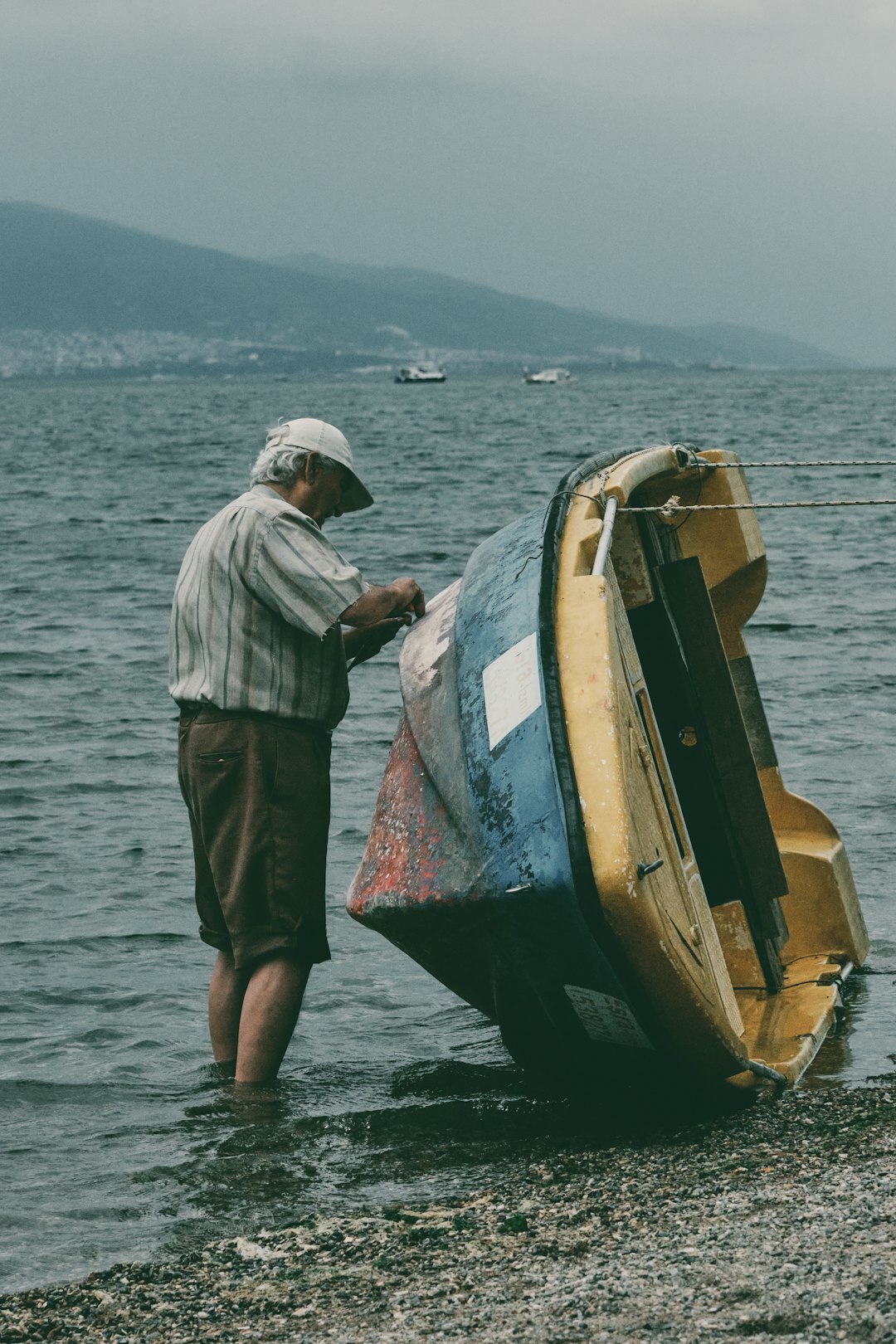 fisherman showing old boat photo