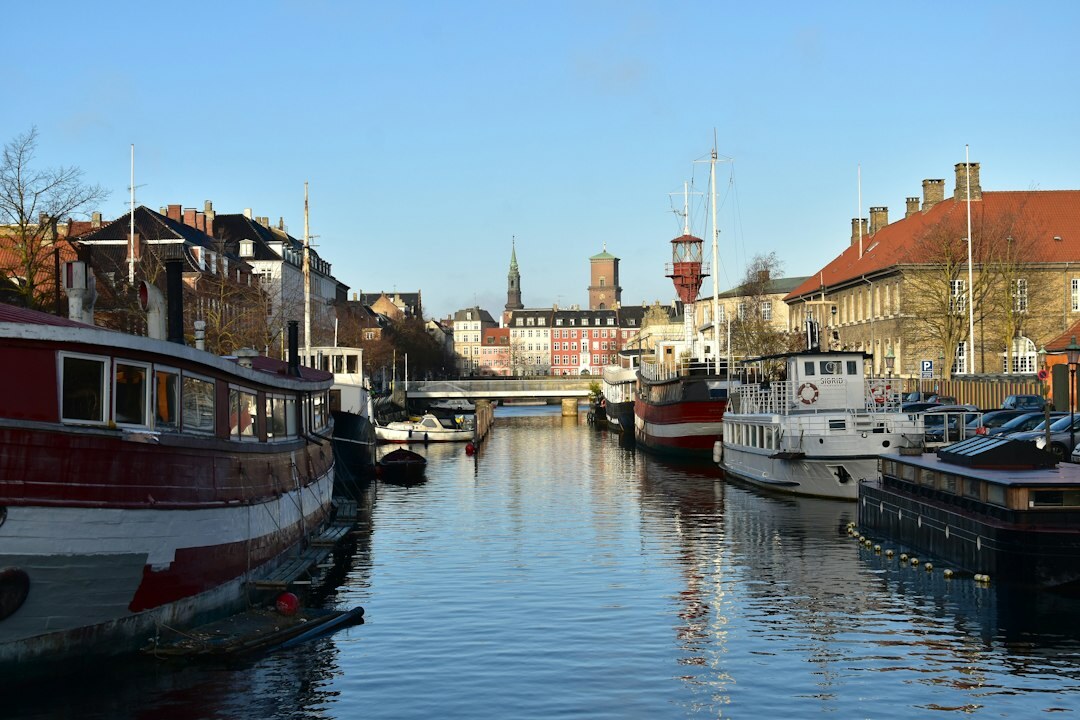 Fishing boats moored in a Danish harbor at sunrise